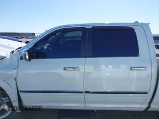 2015 Ram 1500 Laramie Longhorn z VIN 1C6RR7PM0FS508634, wystawiony jako IAAI lot #42125870 z przebiegiem Nie podano mil oraz . Historia ofert i sprzedaży dostępna na DreamBid. Obrazek 14.