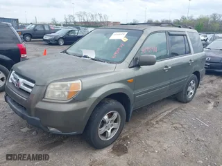 2007 Honda Pilot EX-L with VIN 5FNYF28617B039309, listed as a IAAI auction lot 41951978 with 239,583 mi miles. Bid and sale history available at carsss.com. Image 2.