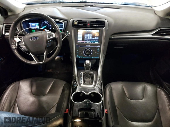 2014 Ford Fusion Titanium Hybrid z VIN 3FA6P0RUXER168706, wystawiony jako Copart lot #55362295 z przebiegiem 136 382 mil mil oraz Czysty tytuł • Clean title. Historia ofert i sprzedaży dostępna na DreamBid. Obrazek 8.