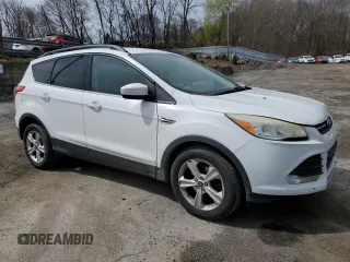 2014 Ford Escape SE with VIN 1FMCU0GX4EUB83323, listed as a Copart auction lot 51775125 with 129,437 mi miles and Salvage Title. Bid and sale history available at DreamBid. Image 4.