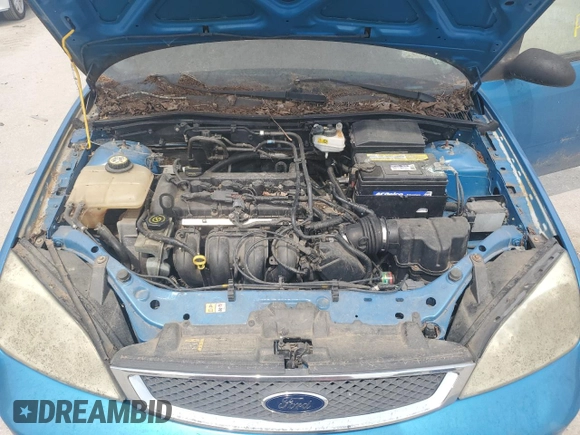 2007 Ford Focus S z VIN 1FAFP31N77W138844, wystawiony jako Copart lot #60702195 z przebiegiem Nie podano mil oraz Czysty tytuł • Clean title. Historia ofert i sprzedaży dostępna na DreamBid. Obrazek 11.