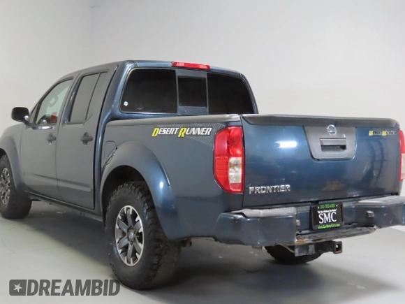 2014 Nissan Frontier SV with VIN 1N6AD0ERXEN763554, listed as a Copart auction lot 64313295 with 109,756 mi miles and Salvage title. Bid and sale history available at DreamBid. Image 4.