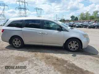 2012 Honda Odyssey EX-L with VIN 5FNRL5H67CB139701, listed as a IAAI auction lot 42233283 with 147,143 mi miles and . Bid and sale history available at DreamBid. Image 14.