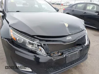 2015 Kia Optima LX with VIN 5XXGM4A7XFG388562, listed as a IAAI auction lot 41937822 with 136,764 mi miles. Bid and sale history available at carsss.com. Image 6.