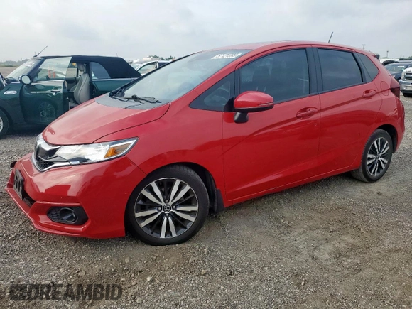 2018 Honda Fit EX-L with VIN 3HGGK5H97JM706911, listed as a Copart auction lot 57121595 with 117,375 mi miles and Salvage title. Bid and sale history available at DreamBid. Image 1.