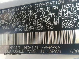 2012 Toyota Yaris L with VIN JTDKTUD35CD531056, listed as a IAAI auction lot 42169341 with 114,955 mi miles. Bid and sale history available at carsss.com. Image 9.