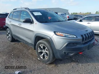 2015 Jeep Cherokee Trailhawk with VIN 1C4PJMBS3FW662307, listed as a IAAI auction lot 41778932 with 64,569 mi miles. Bid and sale history available at carsss.com. Image 1.