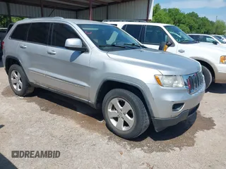 2012 Jeep Grand Cherokee Laredo with VIN 1C4RJEAG4CC167557, listed as a IAAI auction lot 42047720 with 195,631 mi miles. Bid and sale history available at carsss.com. Image 1.