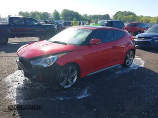2013 Hyundai Veloster Turbo z VIN KMHTC6AE3DU169229, wystawiony jako IAAI lot #42087798 z przebiegiem 120 741 mil mil oraz . Historia ofert i sprzedaży dostępna na DreamBid. Obrazek 2.