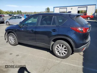 2015 Mazda CX-5 Sport with VIN JM3KE2BEXF0483141, listed as a Copart auction lot 59134105 with 71,727 mi miles and Salvage title. Bid and sale history available at DreamBid. Image 2.
