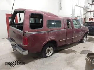1997 Ford F-150 XL with VIN 1FTEX18L3VKC91921, listed as a IAAI auction lot 41820453 with 210,553 mi miles. Bid and sale history available at carsss.com. Image 4.