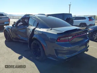 2022 Dodge Charger Scat Pack Widebody with VIN 2C3CDXGJ1NH204130, listed as a IAAI auction lot 41392893 with 9,515 mi miles and . Bid and sale history available at DreamBid. Image 3.