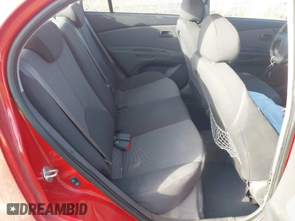 2009 Kia Rio LX with VIN KNADE223796485606, listed as a IAAI auction lot 41676881 with 58,852 mi miles and . Bid and sale history available at DreamBid. Image 8.