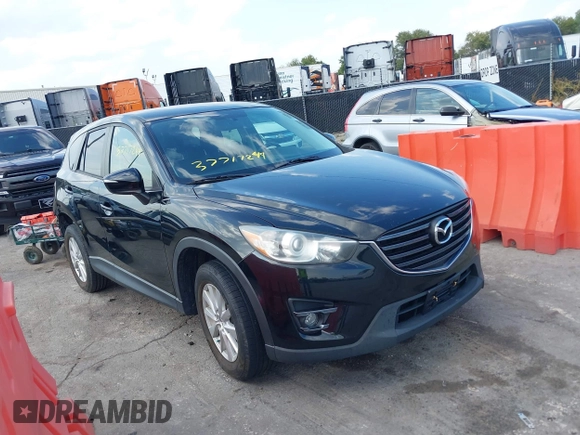 2016 Mazda CX-5 Touring with VIN JM3KE2CY5G0653108, listed as a IAAI auction lot 37717249 with 90,704 mi miles and . Bid and sale history available at DreamBid. Image 1.