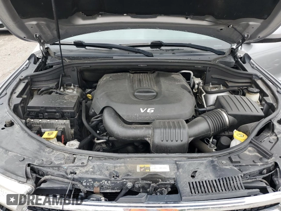 2014 Dodge Durango SXT z VIN 1C4RDJAG8EC596784, wystawiony jako Copart lot #57682215 z przebiegiem 142 008 mil mil oraz Szkoda całkowita • Salvage title. Historia ofert i sprzedaży dostępna na DreamBid. Obrazek 11.