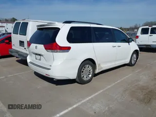 2011 Toyota Sienna XLE AAS with VIN 5TDYK3DCXBS043733, listed as a IAAI auction lot 41601544 with 221,658 mi miles and . Bid and sale history available at DreamBid. Image 4.
