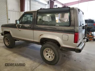 1988 Ford Bronco z VIN 1FMCU14T4JUA54161, wystawiony jako Copart lot #76312054 z przebiegiem 34 932 mil mil oraz Szkoda całkowita • Salvage title. Historia ofert i sprzedaży dostępna na DreamBid. Obrazek 2.