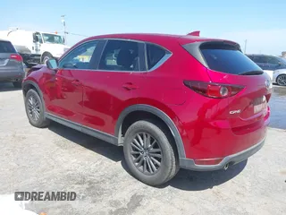 2019 Mazda CX-5 Touring with VIN JM3KFACM5K1516242, listed as a IAAI auction lot 42019803 with 113,953 mi miles. Bid and sale history available at carsss.com. Image 3.