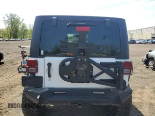 2013 Jeep Wrangler Unlimited Rubicon with VIN 1C4HJWFG2DL549064, listed as a Copart auction lot 56474055 with 148,217 mi miles and Salvage title. Bid and sale history available at DreamBid. Image 6.