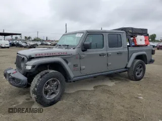 2021 Jeep Gladiator Rubicon с VIN 1C6JJTBG5ML615653, выставлен на аукционе Copart как лот 51297795 с пробегом 48 918 миль миль и Списание • Salvage title. История ставок и продаж доступна на DreamBid. Изображение 1.