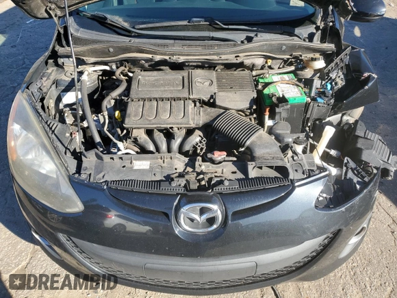 2014 Mazda 2 Touring z VIN JM1DE1LZ7E0179941, wystawiony jako Copart lot #86748264 z przebiegiem 155 816 mil mil oraz Szkoda całkowita • Salvage title. Historia ofert i sprzedaży dostępna na DreamBid. Obrazek 11.