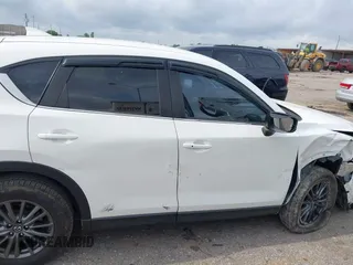 2020 Mazda CX-5 Touring z VIN JM3KFBCM2L0786784, wystawiony jako IAAI lot #42127457 z przebiegiem 62 665 mil mil oraz . Historia ofert i sprzedaży dostępna na DreamBid. Obrazek 13.