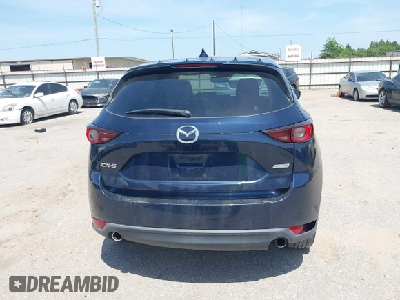 2018 Mazda CX-5 Touring z VIN JM3KFACM7J1410275, wystawiony jako IAAI lot #42248830 z przebiegiem 101 125 mil mil oraz . Historia ofert i sprzedaży dostępna na DreamBid. Obrazek 16.