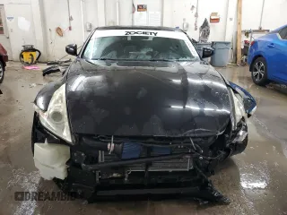2009 Nissan 370Z z VIN JN1AZ44EX9M407193, wystawiony jako Copart lot #84891734 z przebiegiem 129 296 mil mil oraz Szkoda całkowita • Salvage title. Historia ofert i sprzedaży dostępna na DreamBid. Obrazek 5.