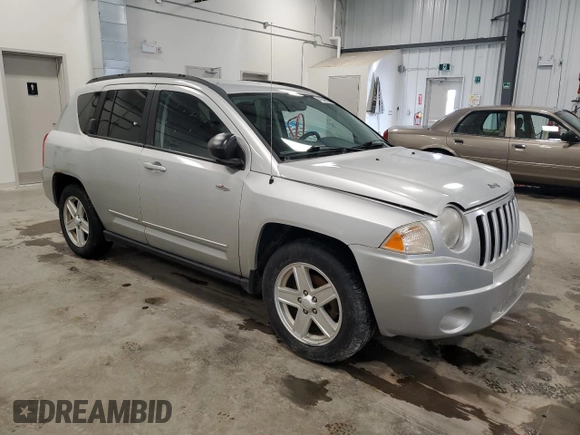 2010 Jeep Compass Sport with VIN 1J4NF4FB4AD512613, listed as a Copart auction lot 47548255 with 123,149 mi miles and Clean Title. Bid and sale history available at carsss.com. Image 4.