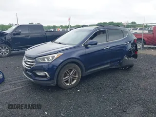 2017 Hyundai Santa Fe 2.4L z VIN 5XYZU3LB7HG418300, wystawiony jako IAAI lot #42369329 z przebiegiem 126 326 mil mil oraz . Historia ofert i sprzedaży dostępna na DreamBid. Obrazek 2.