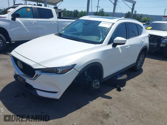 2020 Mazda CX-5 Grand Touring with VIN JM3KFADM9L0821930, listed as a IAAI auction lot 42549986 with 29,929 mi miles and . Bid and sale history available at DreamBid. Image 17.