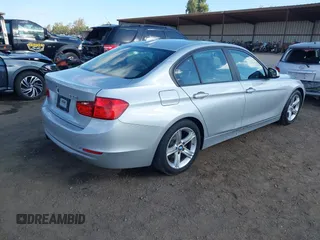 2013 BMW 3 Series 328i with VIN WBA3C1C52DF440786, listed as a IAAI auction lot 40777716 with 171,385 mi miles. Bid and sale history available at carsss.com. Image 4.