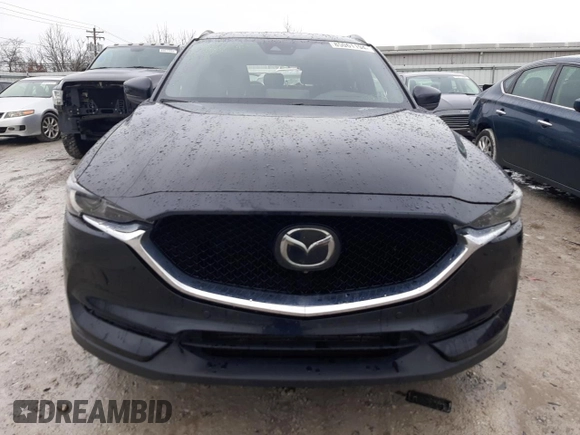 2021 Mazda CX-5 Signature with VIN JM3KFBEY8M0436075, listed as a Copart auction lot 85061194 with 66,471 mi miles and Salvage Title. Bid and sale history available at carsss.com. Image 5.
