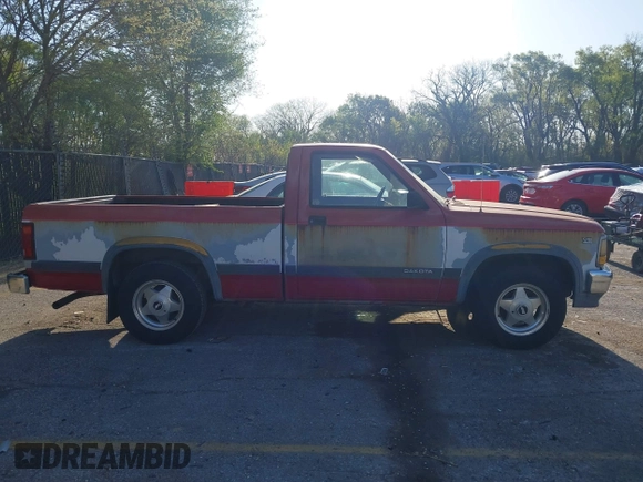 1991 Dodge Dakota "S" with VIN 1B7FL26X4MS257044, listed as a IAAI auction lot 42038980 with 120,127 mi miles. Bid and sale history available at carsss.com. Image 13.