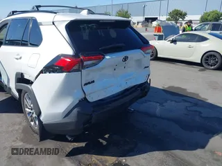 2023 Toyota RAV4 XLE Premium with VIN 2T3C1RFV7PW299428, listed as a IAAI auction lot 42527306 with 9,853 mi miles and . Bid and sale history available at DreamBid. Image 6.