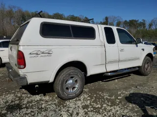 1999 Ford F-150 XL with VIN 1FTRX18L1XNB18305, listed as a Copart auction lot 51336985 with 173,904 mi miles and Clean Title. Bid and sale history available at carsss.com. Image 3.