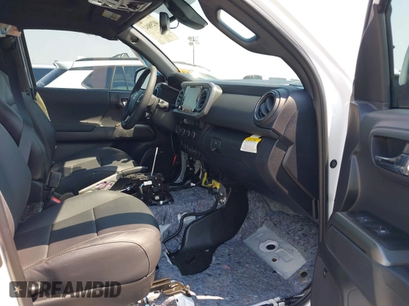 2023 Toyota Tacoma SR with VIN 3TMCZ5AN7PM630874, listed as a IAAI auction lot 40298041 with 8,635 mi miles and . Bid and sale history available at DreamBid. Image 5.