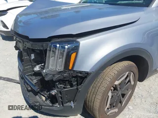 2025 Kia Telluride S with VIN 5XYP64GC6SG622930, listed as a IAAI auction lot 42643647 with 11,056 mi miles and . Bid and sale history available at DreamBid. Image 6.