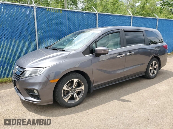 2018 Honda Odyssey with VIN 5FNRL6H49JB504977, listed as a Copart auction lot 60905615 with 180,464 mi miles and Clean title. Bid and sale history available at DreamBid. Image 1.