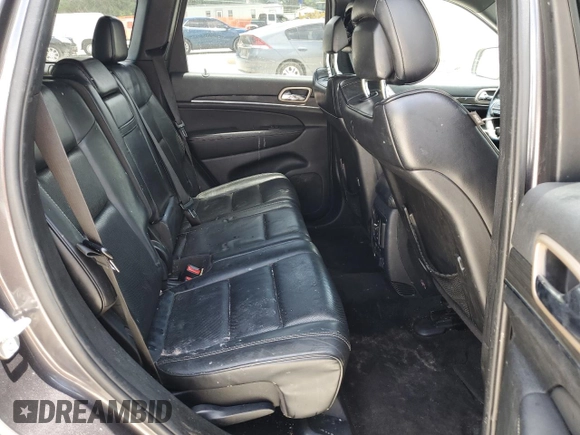 2014 Jeep Grand Cherokee Overland with VIN 1C4RJFCT7EC182234, listed as a Copart auction lot 54754465 with 185,658 mi miles and Salvage Title. Bid and sale history available at DreamBid. Image 11.