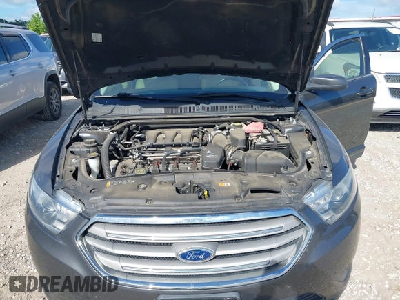 2015 Ford Taurus SEL with VIN 1FAHP2E87FG156969, listed as a IAAI auction lot 42506157 with 99,184 mi miles and . Bid and sale history available at DreamBid. Image 10.