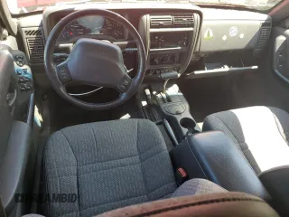 1999 Jeep Cherokee Sport z VIN 1J4FF68SXXL525944, wystawiony jako Copart lot #57653905 z przebiegiem 102 057 mil mil oraz Szkoda całkowita • Salvage title. Historia ofert i sprzedaży dostępna na DreamBid. Obrazek 8.