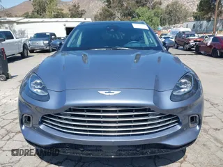 2021 Aston Martin DBX z VIN SCFVUJAW8MTV02568, wystawiony jako IAAI lot #42183964 z przebiegiem 53 608 mil mil oraz . Historia ofert i sprzedaży dostępna na DreamBid. Obrazek 12.