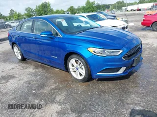 2018 Ford Fusion SE z VIN 3FA6P0LU6JR227205, wystawiony jako IAAI lot #42254815 z przebiegiem 124 851 mil mil oraz . Historia ofert i sprzedaży dostępna na DreamBid. Obrazek 1.