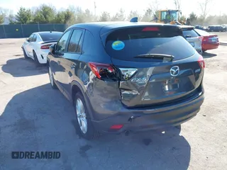 2014 Mazda CX-5 Grand Touring with VIN JM3KE4DY4E0320695, listed as a IAAI auction lot 41989350 with 169,391 mi miles and . Bid and sale history available at DreamBid. Image 3.