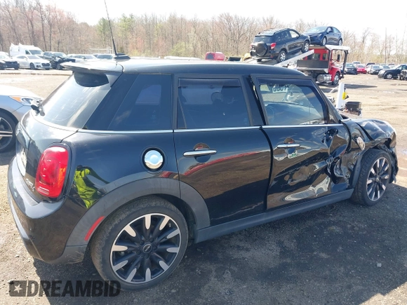 2017 MINI Hardtop 4 Door Cooper S z VIN WMWXU3C39H2F48699, wystawiony jako IAAI lot #41924423 z przebiegiem 81 249 mil mil oraz . Historia ofert i sprzedaży dostępna na DreamBid. Obrazek 18.