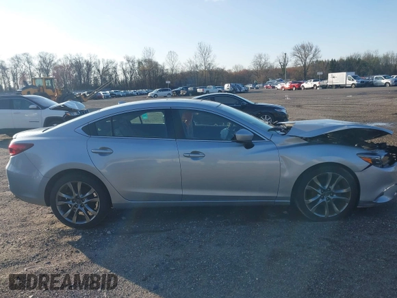 2017 Mazda 6 Grand Touring with VIN JM1GL1W50H1132261, listed as a IAAI auction lot 41930610 with 54,431 mi miles and . Bid and sale history available at DreamBid. Image 13.