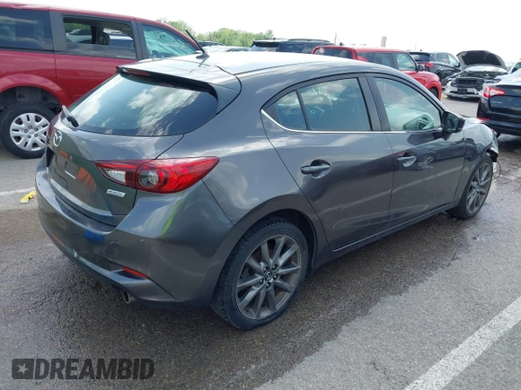 2018 Mazda 3 Touring z VIN 3MZBN1L35JM271525, wystawiony jako IAAI lot #42112552 z przebiegiem 107 299 mil mil oraz . Historia ofert i sprzedaży dostępna na DreamBid. Obrazek 4.