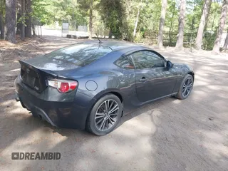 2013 Scion FR-S with VIN JF1ZNAA12D1718693, listed as a IAAI auction lot 42077260 with 110,164 mi miles. Bid and sale history available at carsss.com. Image 4.