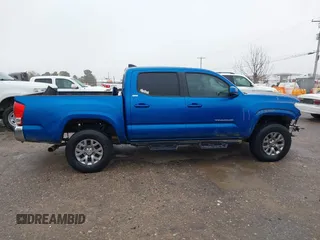 2016 Toyota Tacoma SR with VIN 5TFCZ5AN4GX013233, listed as a IAAI auction lot 41394610 with 142,099 mi miles and . Bid and sale history available at DreamBid. Image 13.